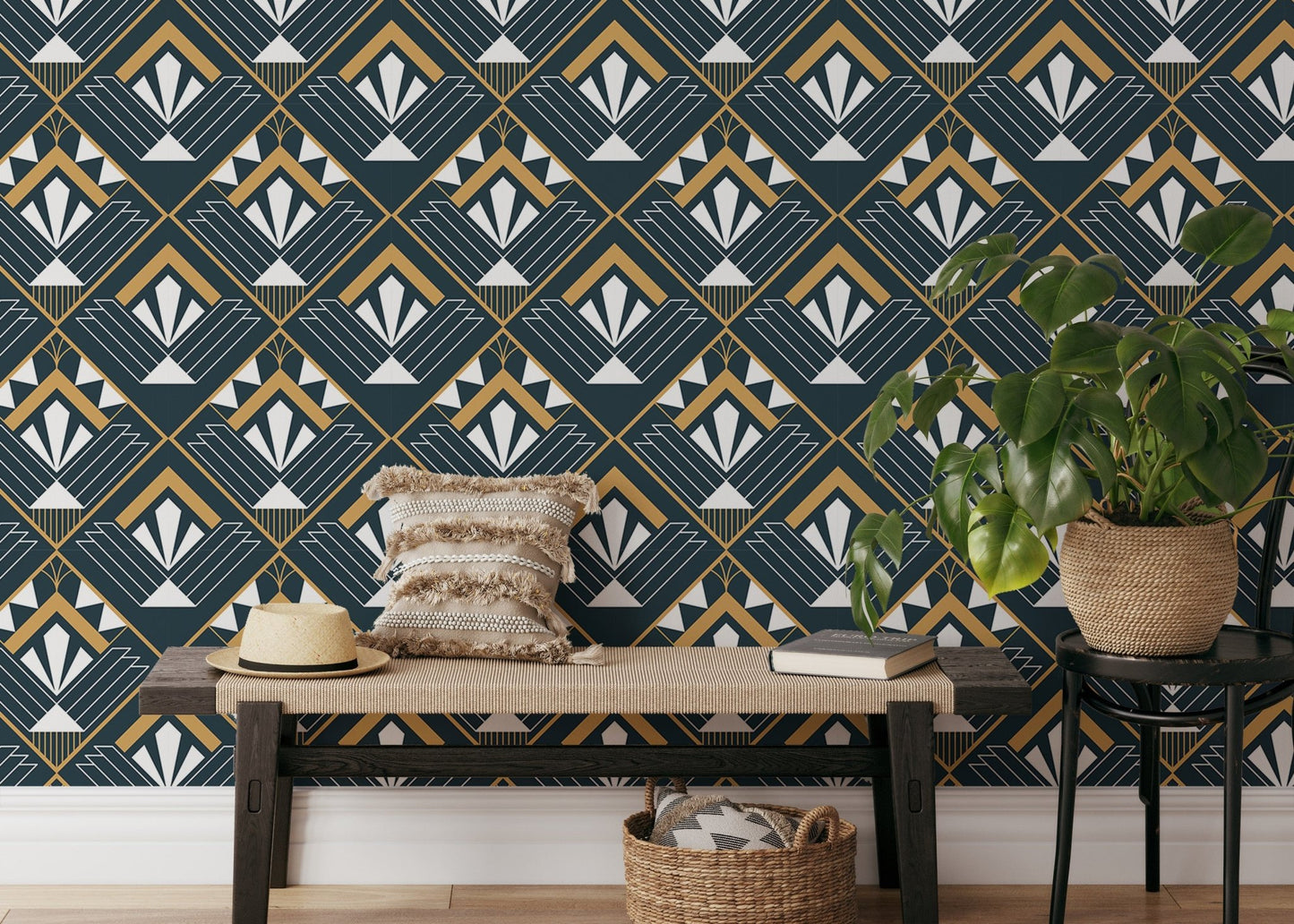 Navy and gold geometric abstract wallpaper in a room with a wooden bench and plants.