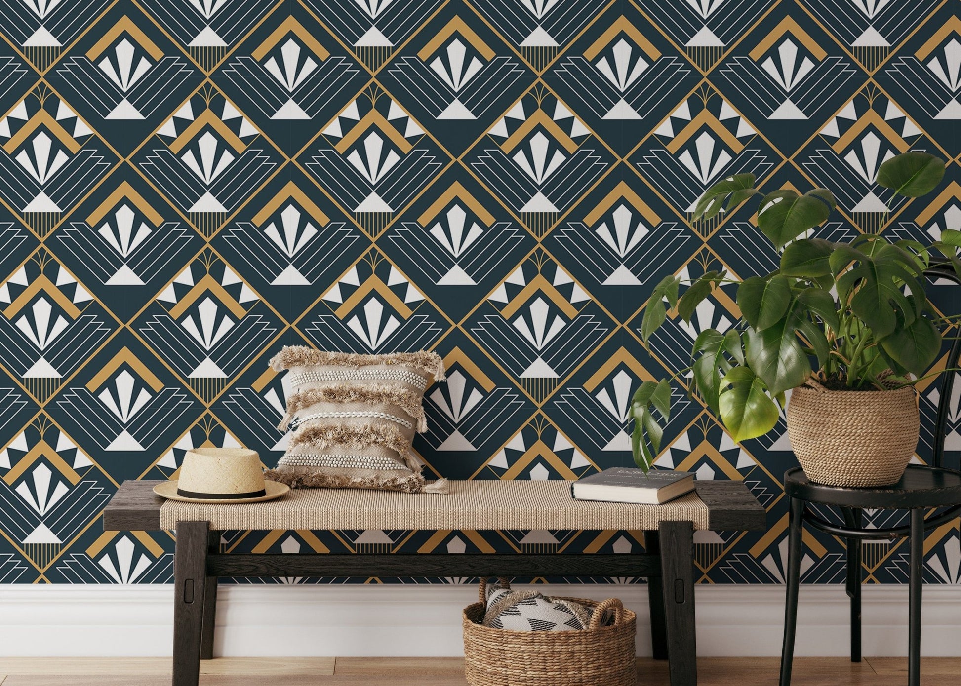 Navy and gold geometric abstract wallpaper in a room with a wooden bench and plants.