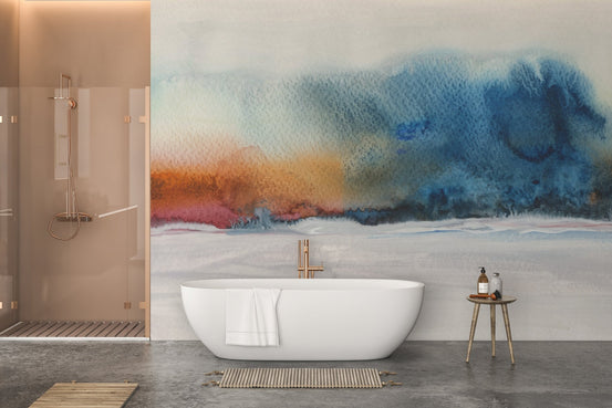 Minimalist bathroom featuring a blue watercolor wall mural behind a white bathtub.