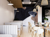 Artistic mural featuring dynamic waves of watercolor design in dining area.
