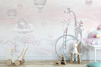 Kids play area with pink hot air balloon wall mural and wooden toys.