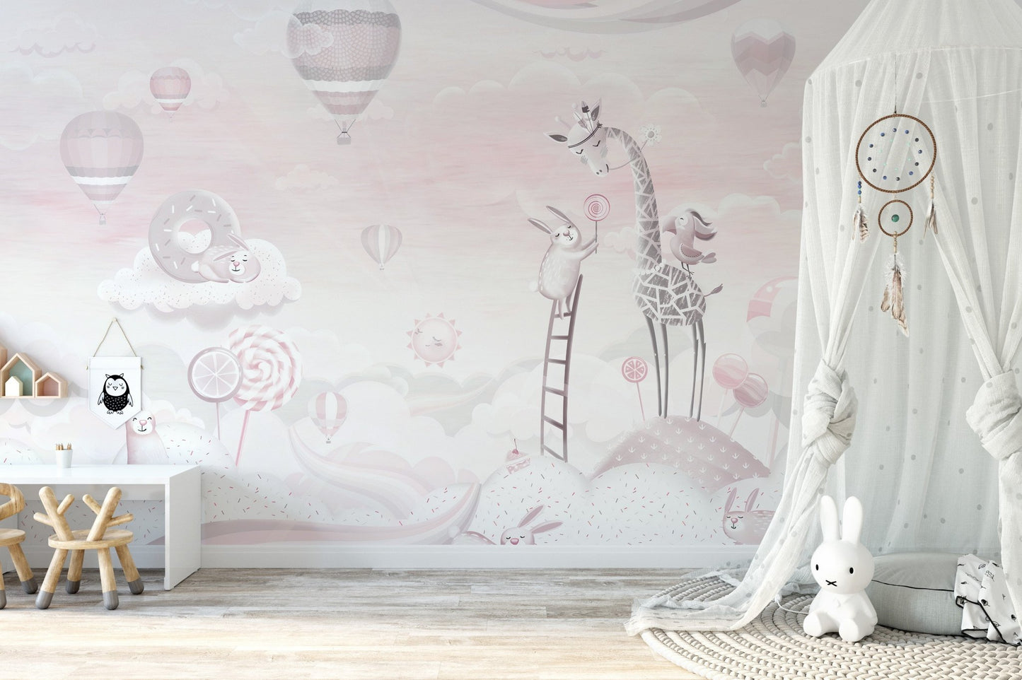 Minimalist nursery with grey and pink animal themed wall mural
