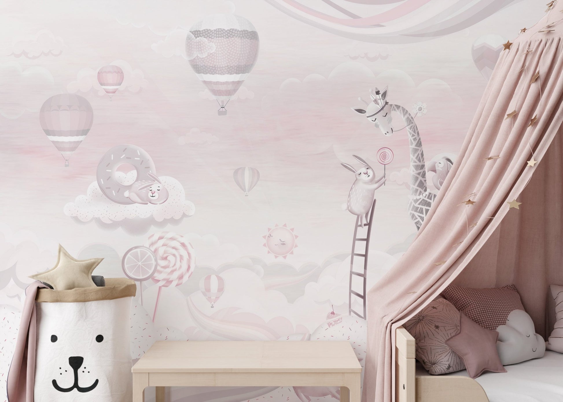 Pink cartoon wall mural with animal illustrations behind a white canopy.