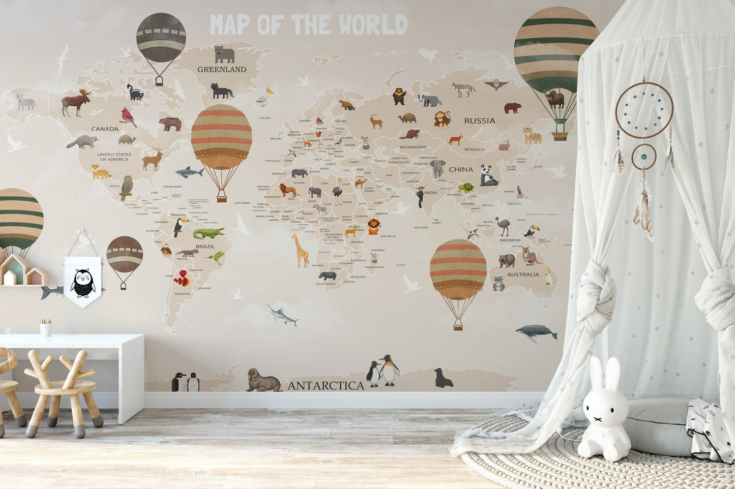 Neutral toned world map wall mural with a white canopy tent.