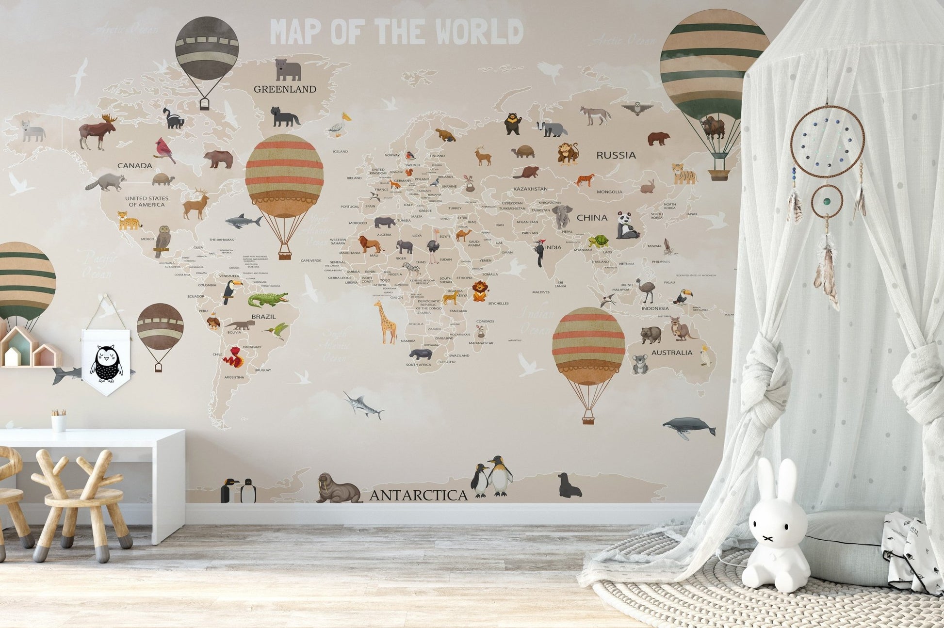 Neutral toned world map wall mural with a white canopy tent.