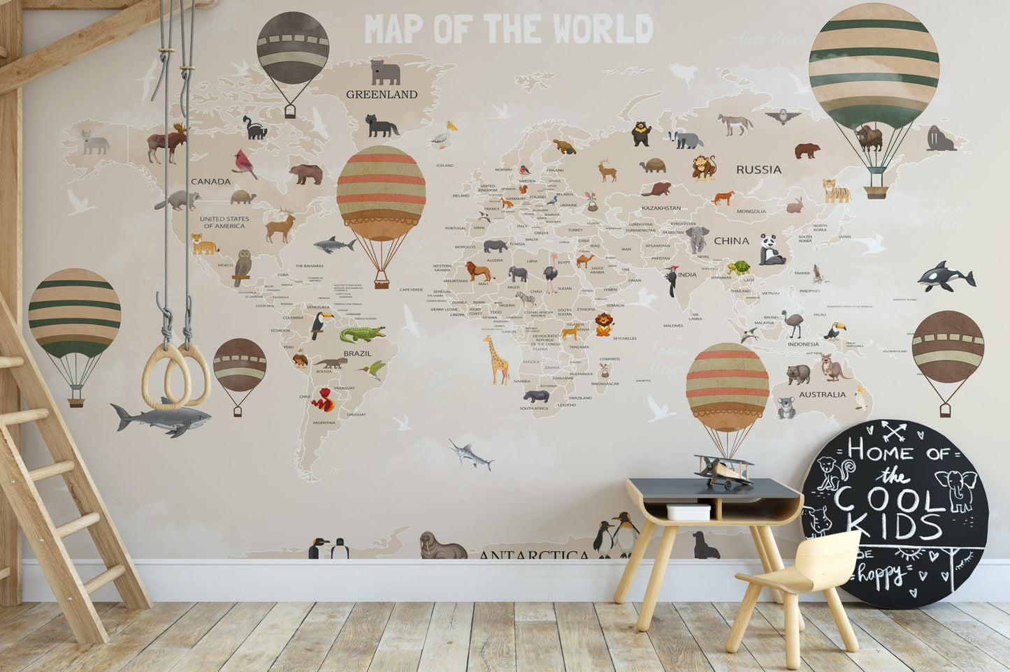 Adventurous Animals Map Wall Murals behind a wood table and chairs.
