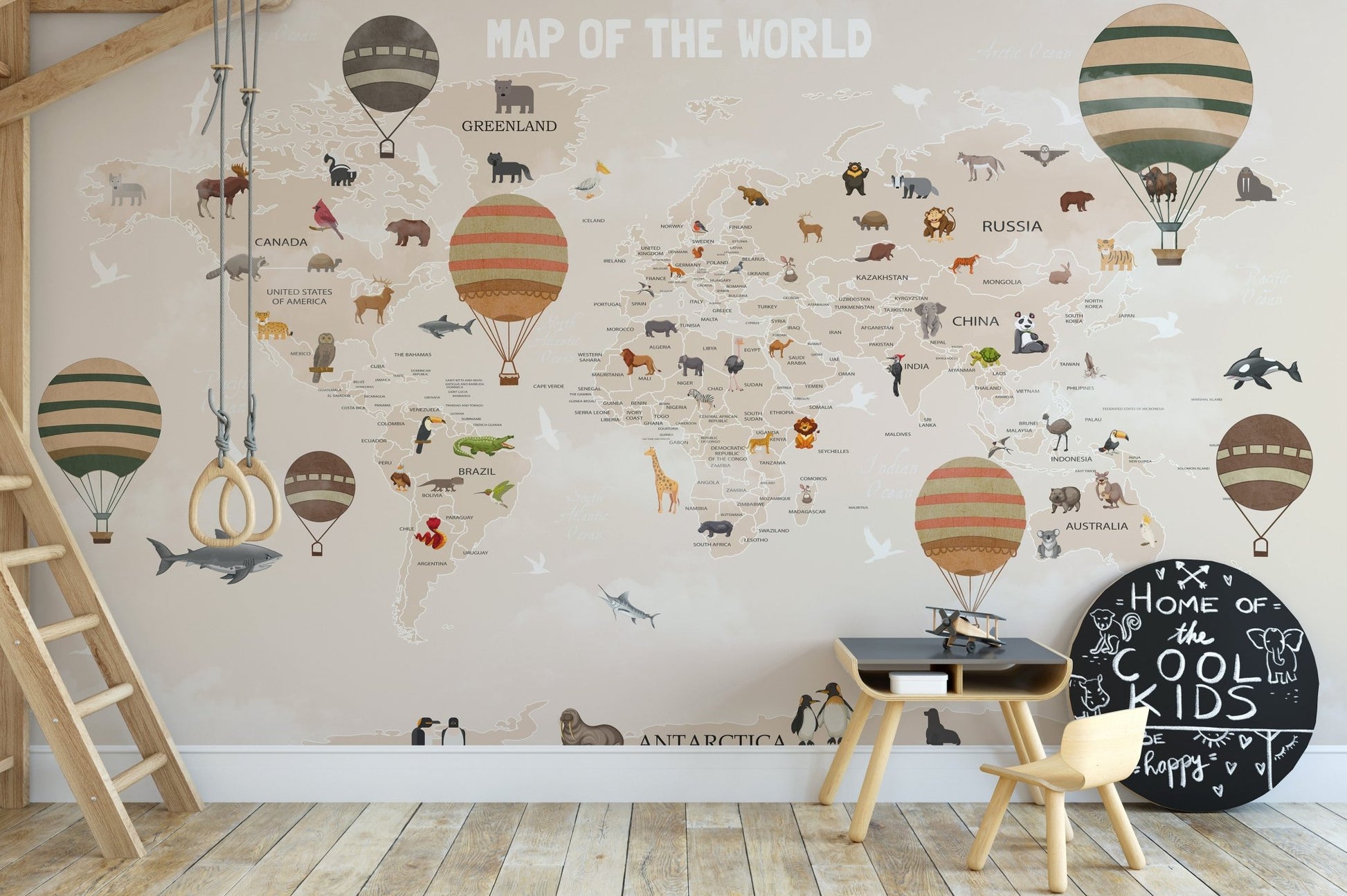 Adventurous Animals Map Wall Murals behind a wood table and chairs.