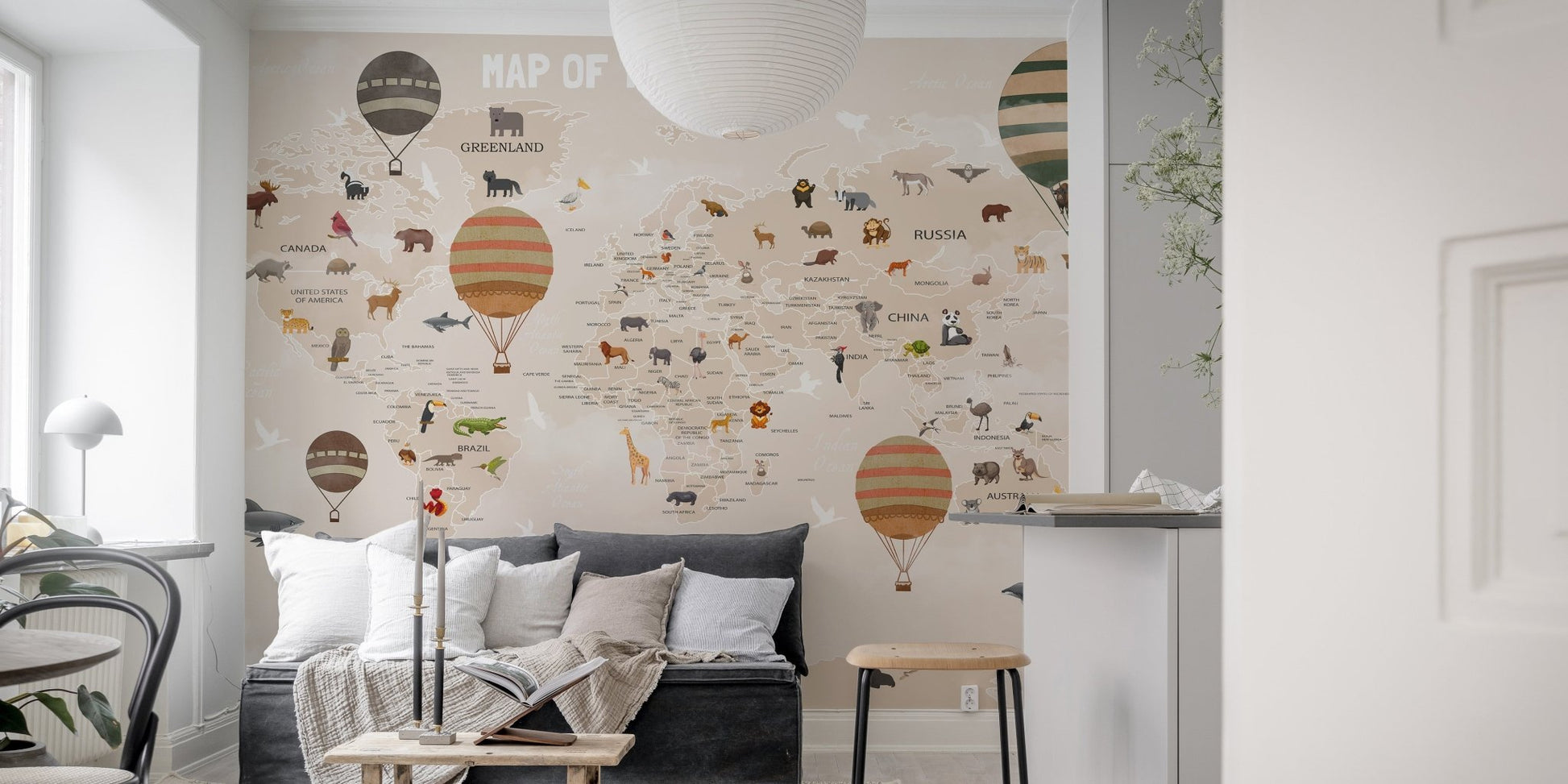 Wall mural featuring a map with adventurous animals and nature in living area.
