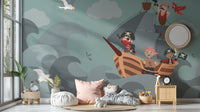 Adventurous pirate ship wall mural with cartoon pirates on teal ocean waves.