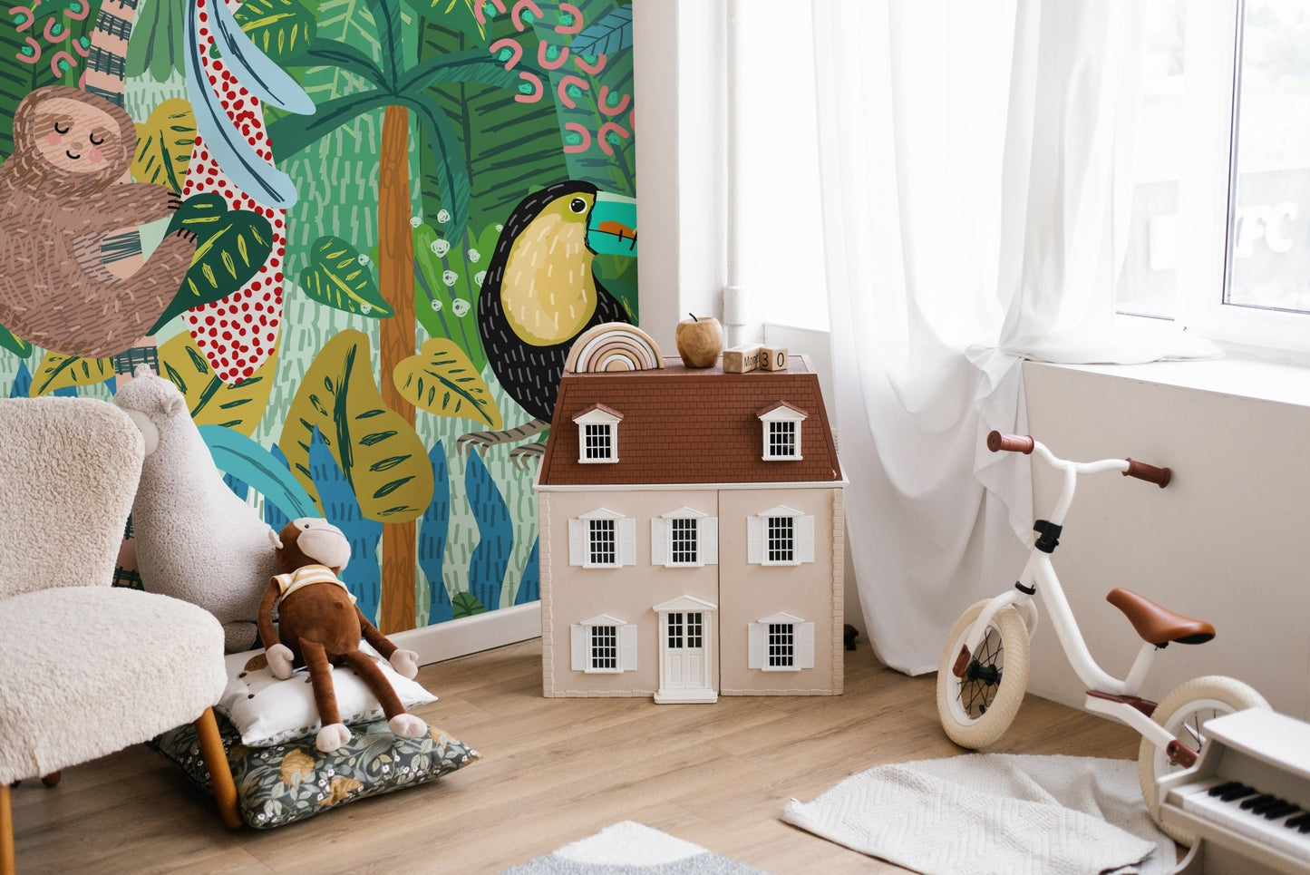Hand-drawn wildlife wall mural featuring a brown sloth and black bird.