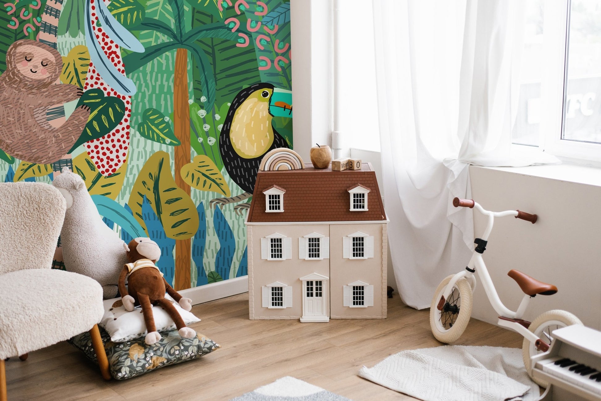Hand-drawn wildlife wall mural featuring a brown sloth and black bird.