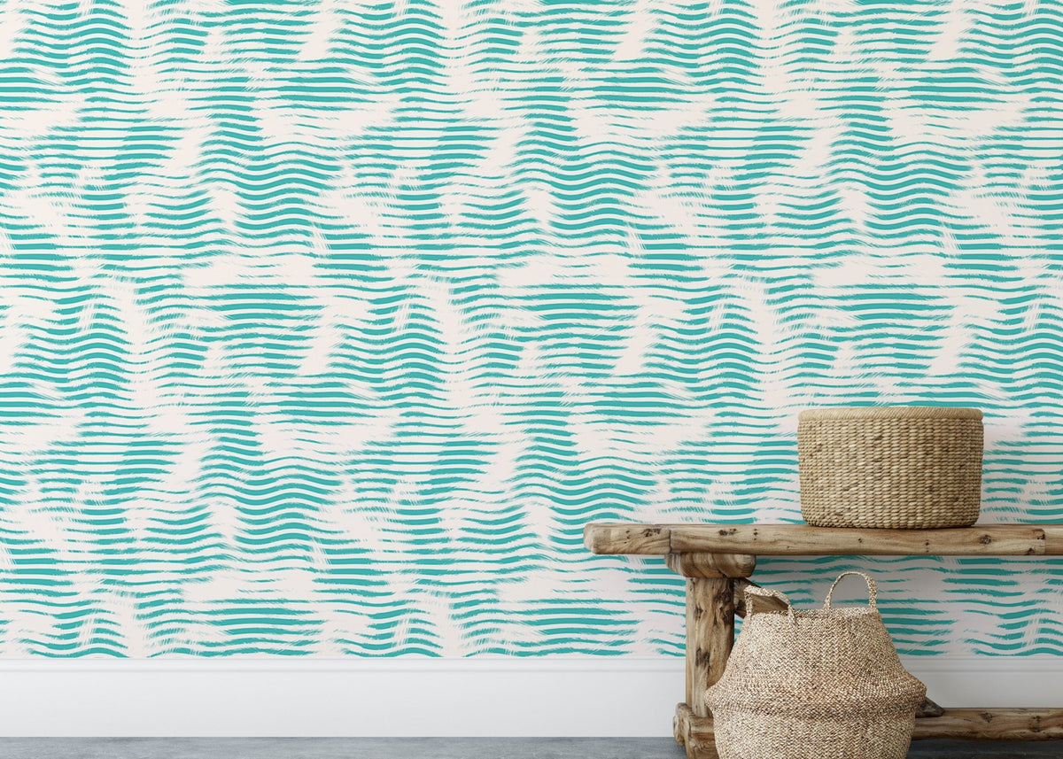 Aegean teal broken stripe wallpaper behind a rustic wooden bench and woven baskets.