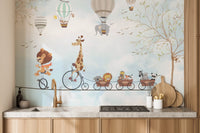 Animal parade wall mural for a kitchen backsplash area with light wood cabinets.