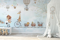 Whimsical animal wall mural in a bedroom featuring a white canopy tent and floor mat.