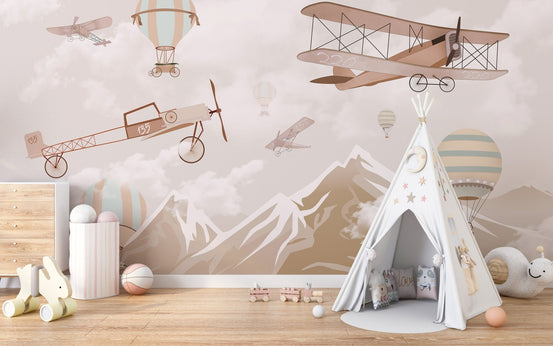 Aerial Mountain Dreams wall mural with vintage planes in a neutral nursery.