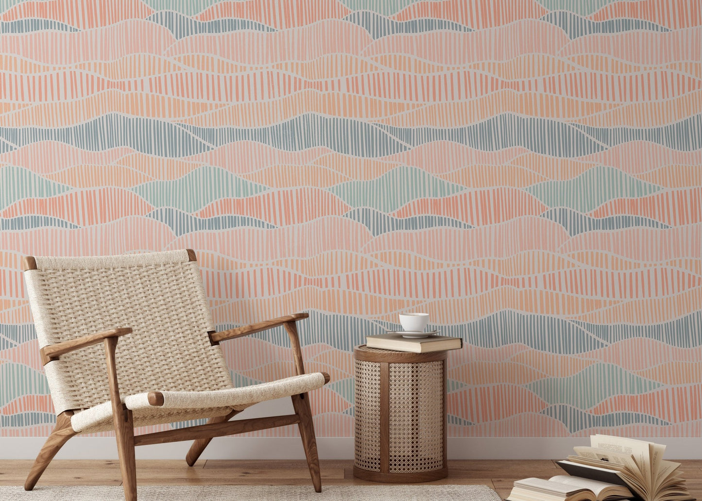 Light peach and teal boho wallpaper in a reading area with a wooden armchair.