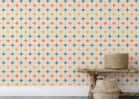Low angle view of star patterned wall mural in a room with a woven basket.