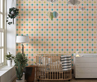 Nursery room featuring seamless star wall mural with a wooden crib and floor lamp.