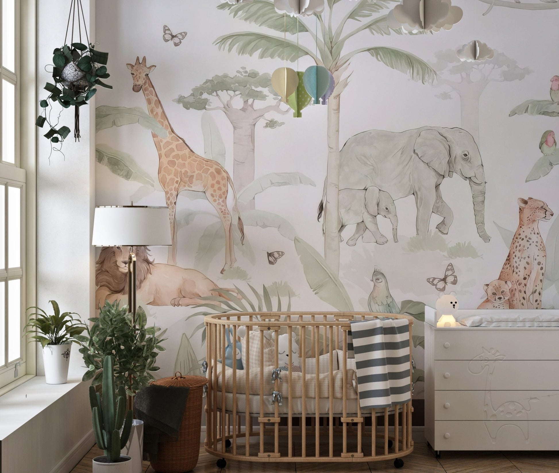 African safari animals wall mural in soft green and earth tones.