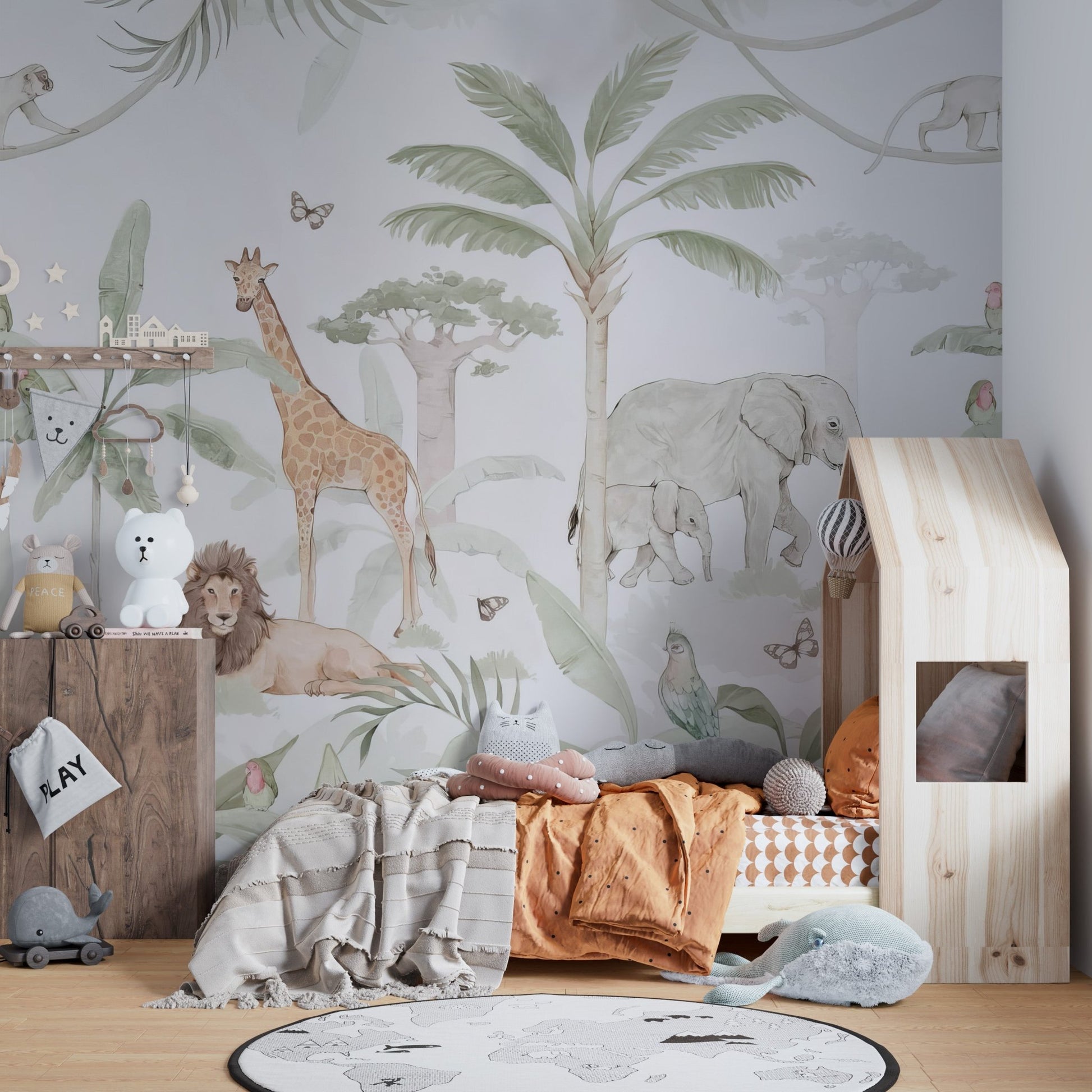 Elephant family and tropical foliage peel and stick wallpaper.
