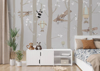 Panda pilot wall mural behind a white storage cabinet in a sunlit nursery.