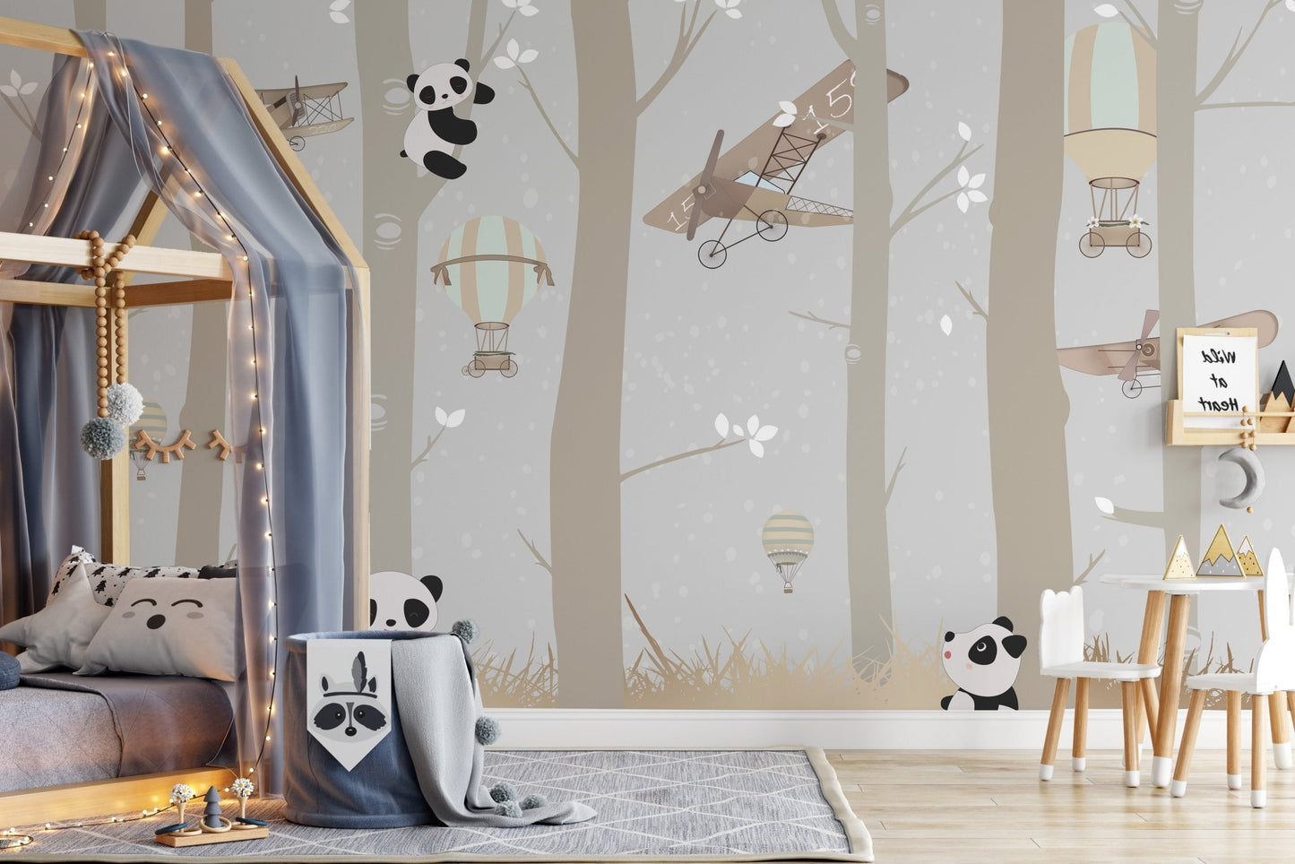 Panda aviator wall mural in a modern child's bedroom with a tall bunk bed.