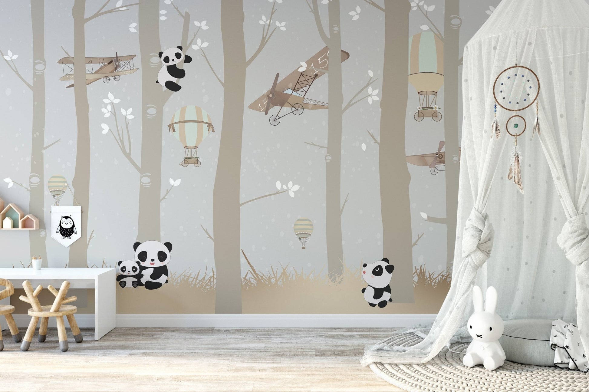 Grey and beige wall mural featuring planes and pandas in a minimalist nursery.