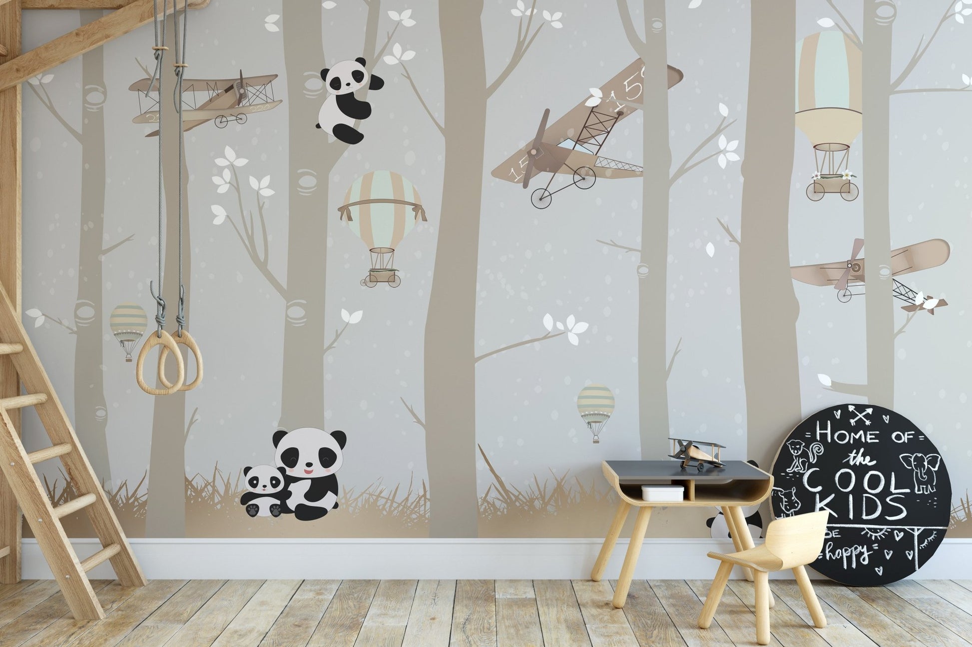 Forest tree wall mural with panda illustrations in a creative play space.