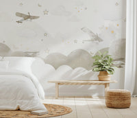 Soft watercolor airplane graphics on a starry background wall mural.