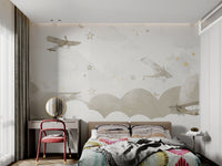 Classic airplanes soaring wall mural with hanging stars for child's bedroom.