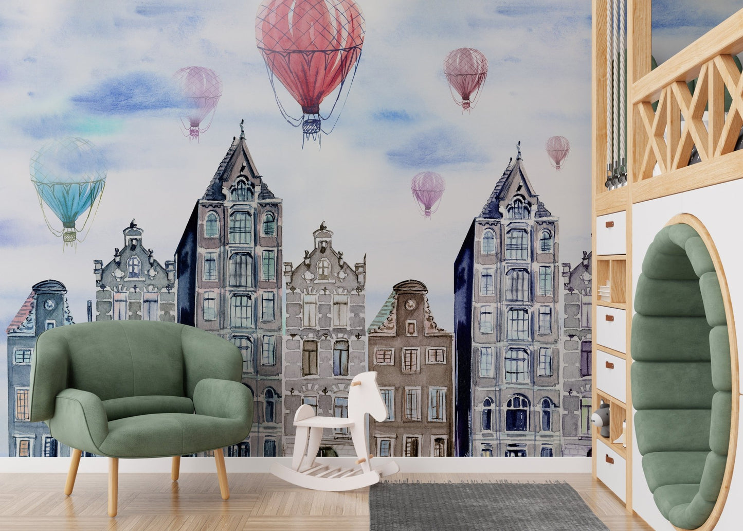 Kids playroom wall mural showing watercolor buildings and a green armchair.