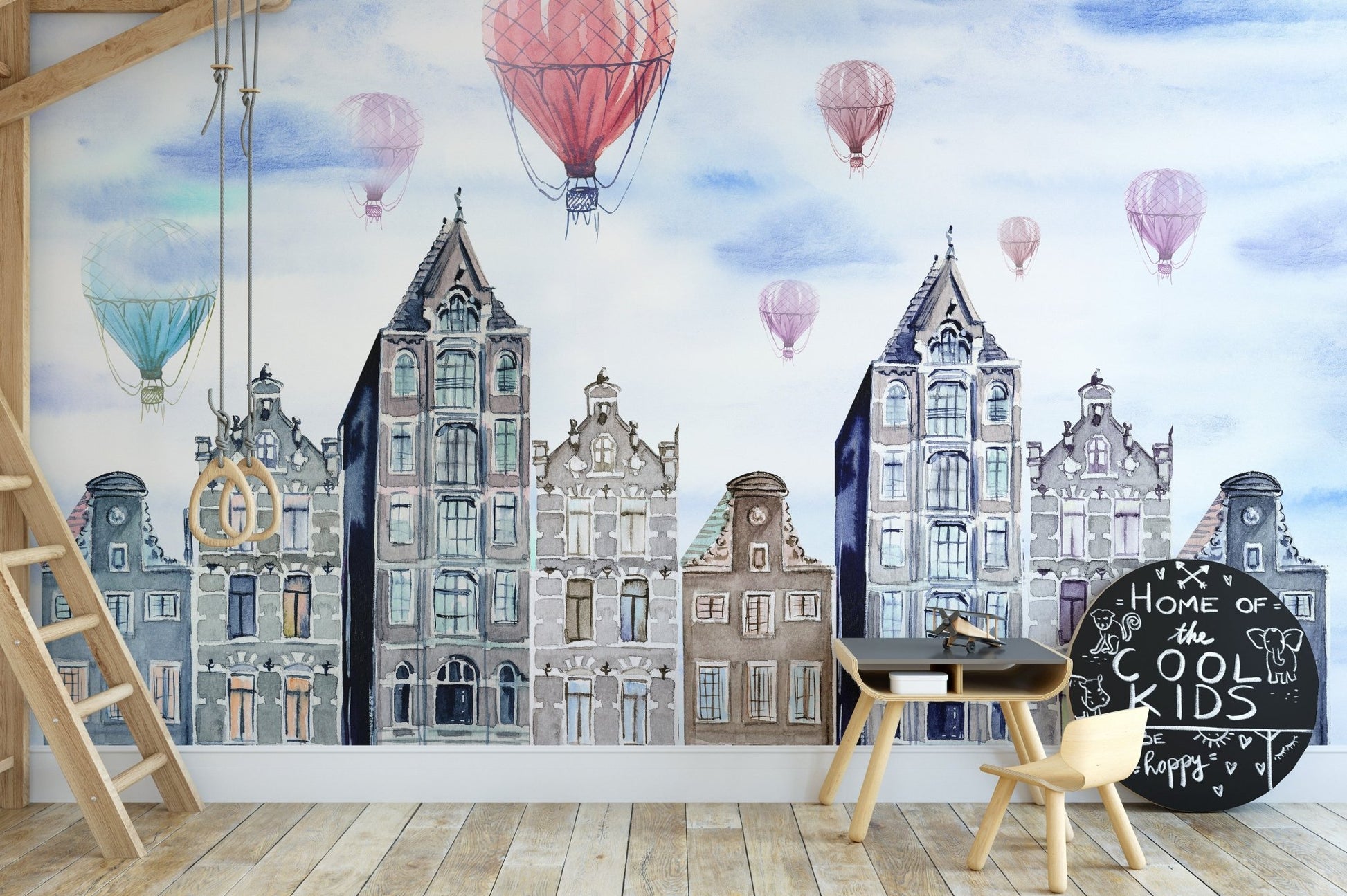 Amsterdam Hues Watercolor Cityscape Mural in a study area with small wooden chairs.