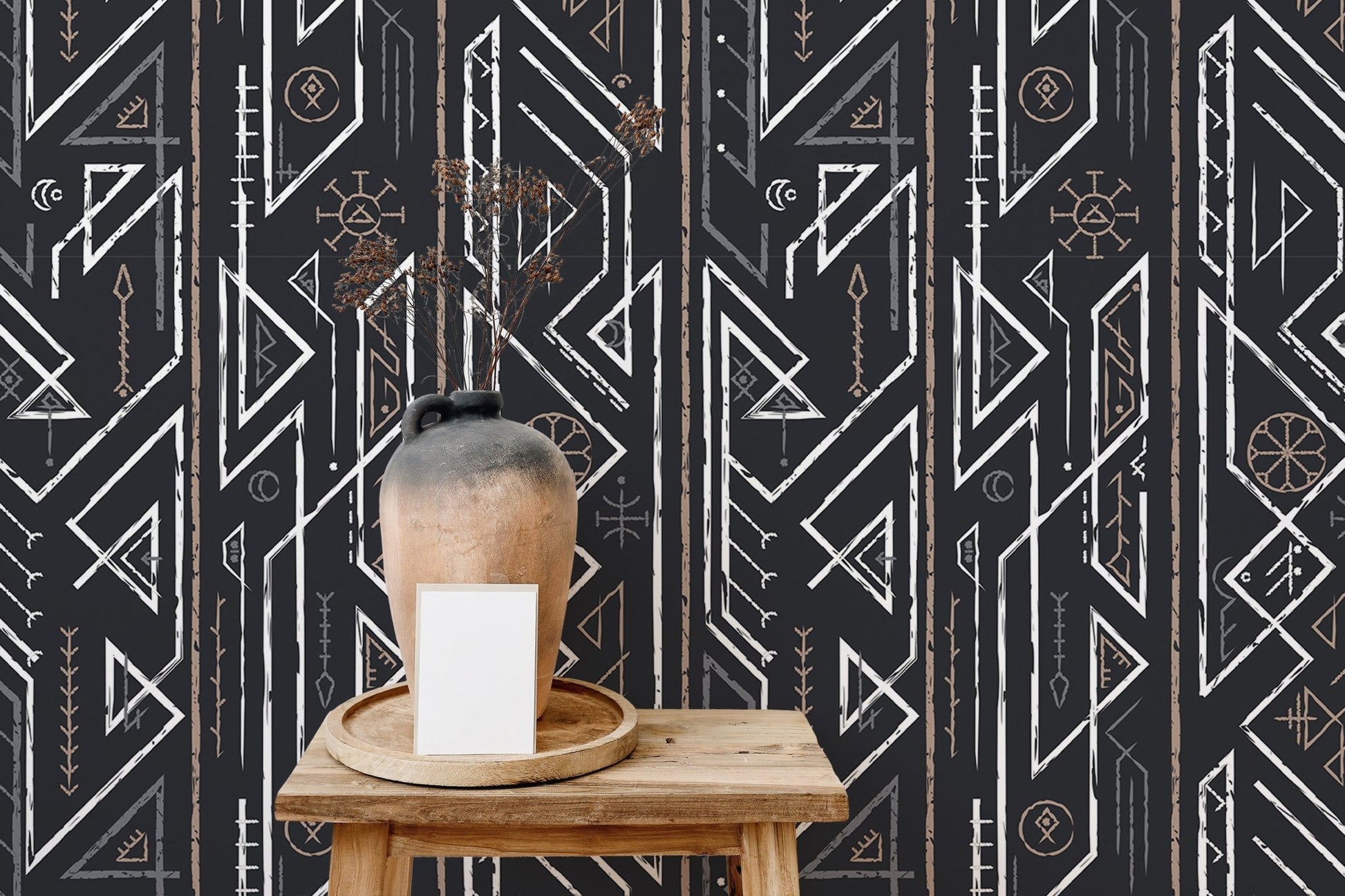 Wooden stool and vase against dark geometric wallpaper in a minimalist room.