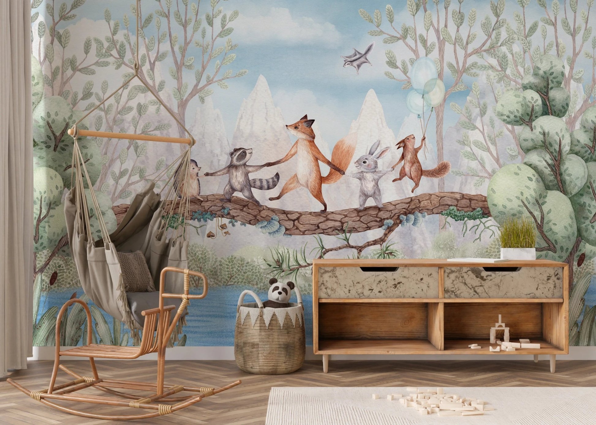 Toddler space with a wooden cabinet and animal adventure wall mural.