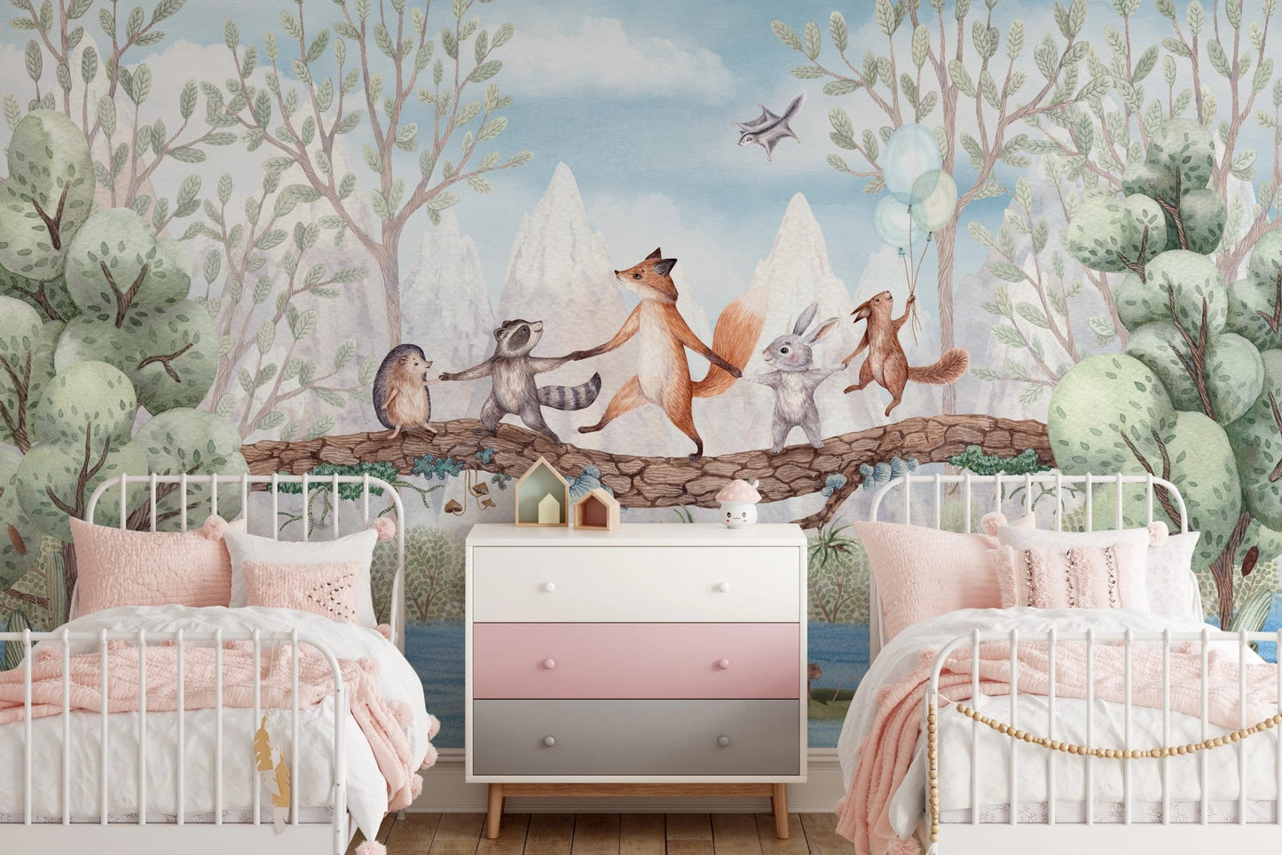 Twin bedroom with pink accents and animal adventure wall mural backdrop.