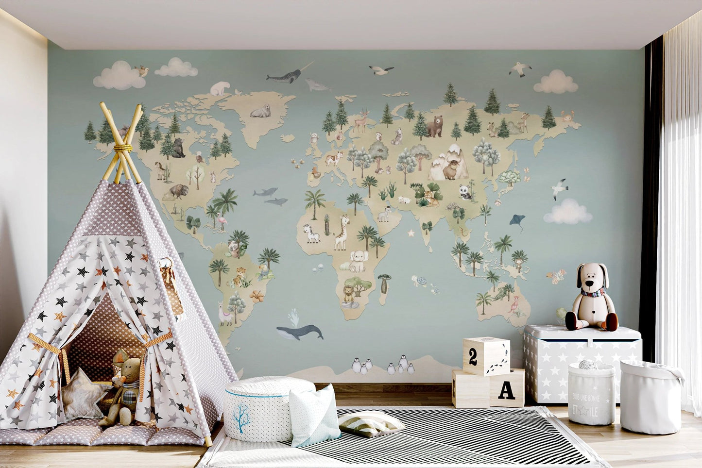 Kids play tent and storage bins in front of a blue atlas wall mural.
