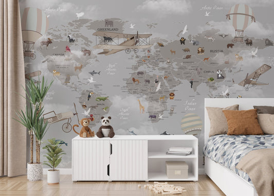 Kids bedroom featuring a grey world map wall mural with animal illustrations.
