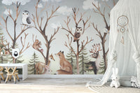 Animals brown tropical forest wall mural with a white teepee and wooden toys.
