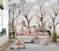 Brown forest animal wall mural behind a white toddler bed and grey rug.
