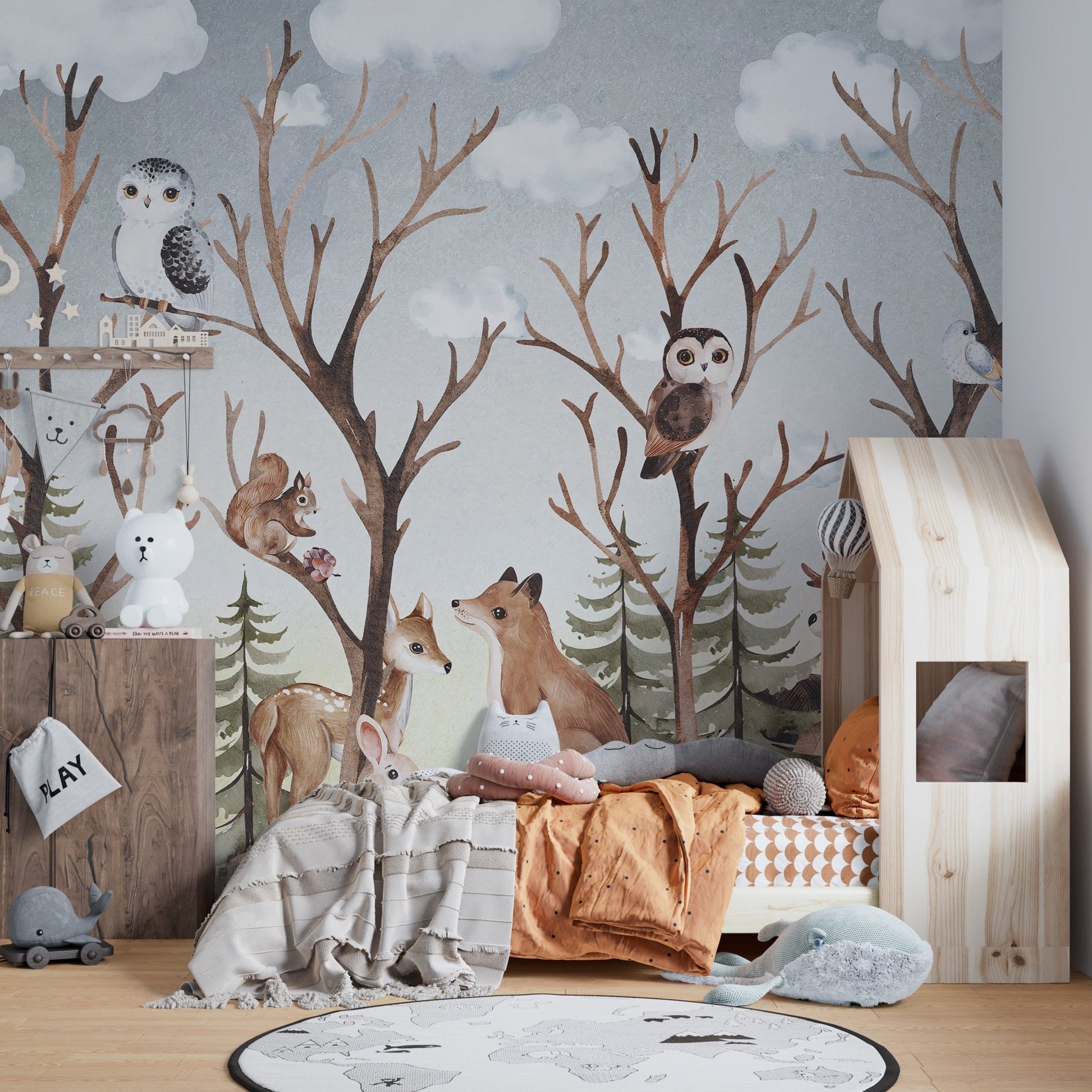Soft grey and brown forest wall mural with animals in a sunlit bedroom.
