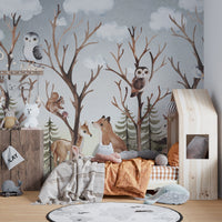 Soft grey and brown forest wall mural with animals in a sunlit bedroom.