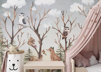 Minimalist nursery wall mural showing forest animal near a pink bed canopy.
