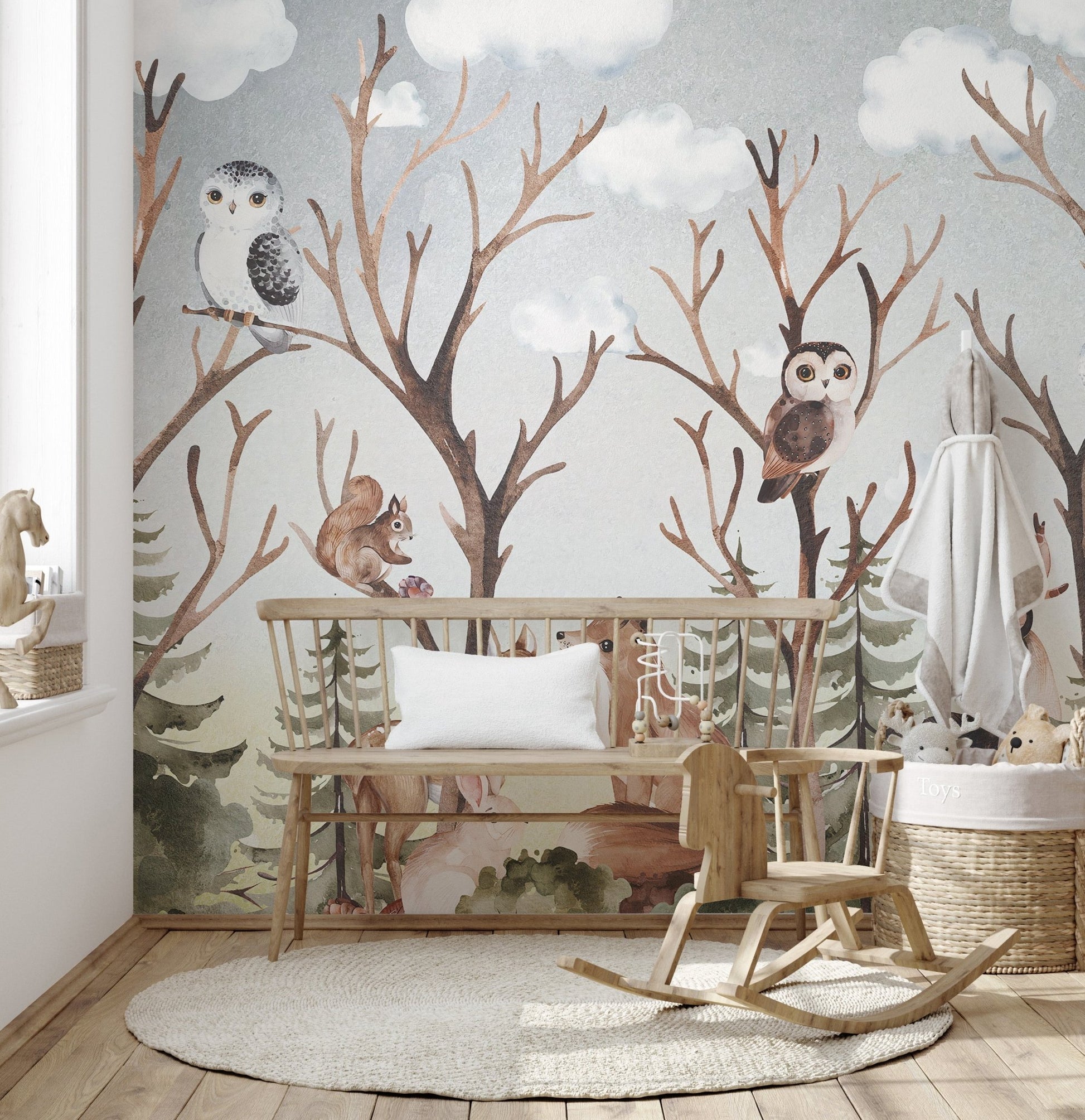 Brown-themed wall mural with tropical forest animals in nursery.