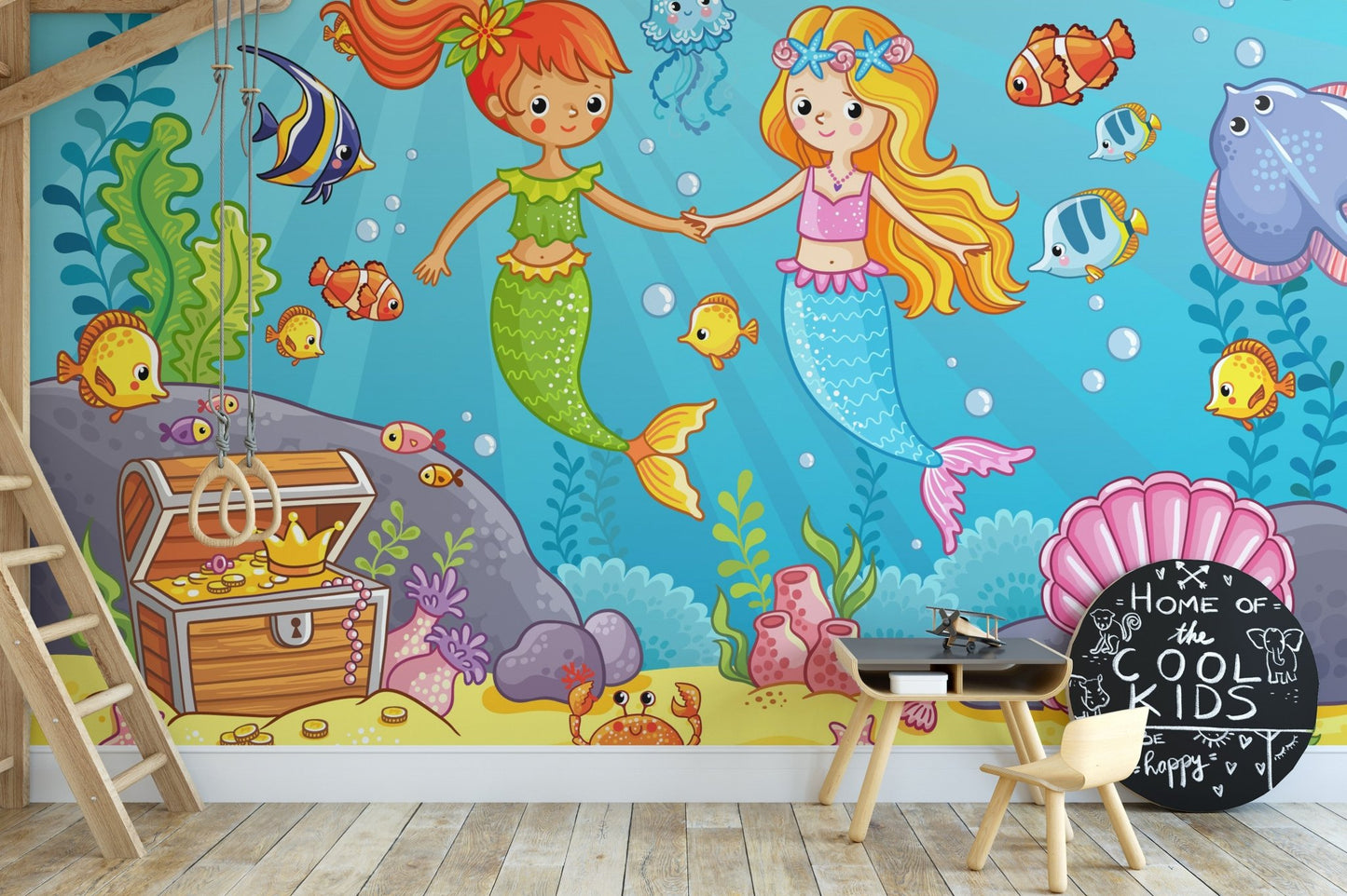 Underwater mermaid scene wall mural with pink shells and yellow coral in a nursery.