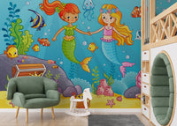 Green armchair placed in front of an Aqua Alliance Mermaid Best Friend wall mural.