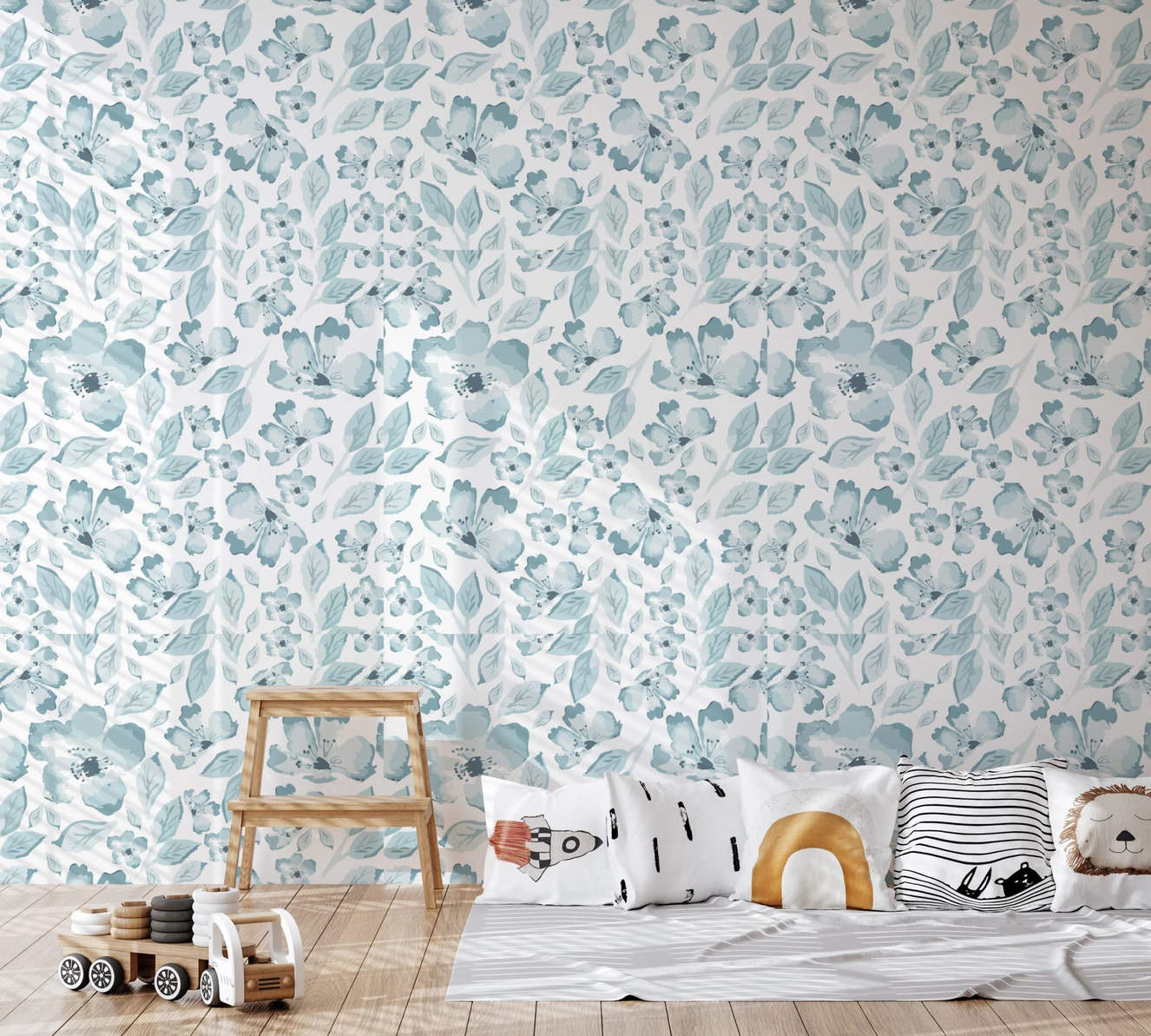 Kids play area with light blue bloom pattern wallpaper.