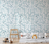 Kids play area with light blue bloom pattern wallpaper.