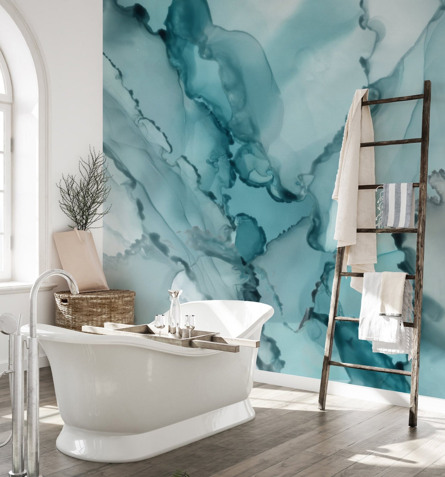 Large scale aqua ink wall mural in a bathroom featuring a wooden towel ladder.