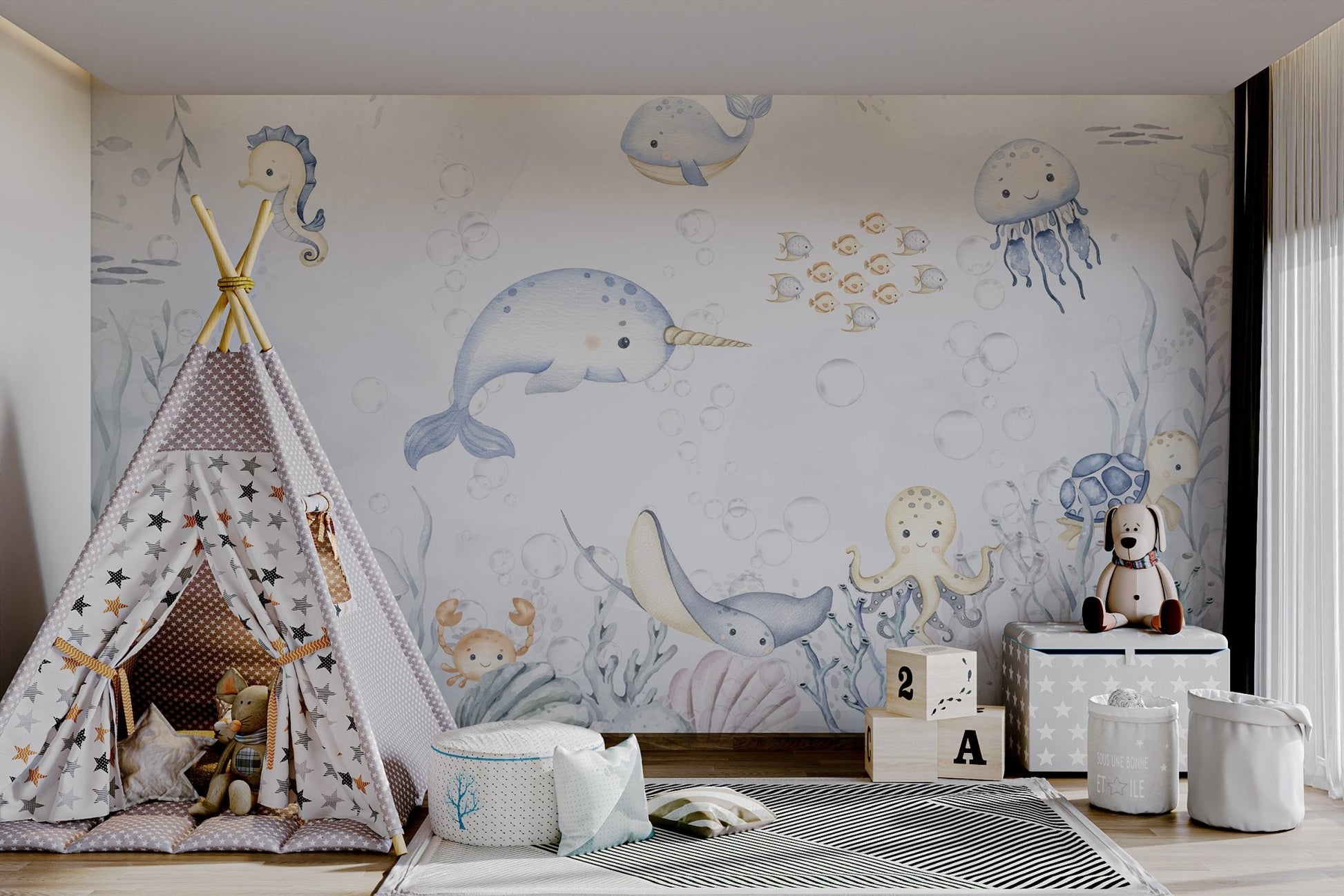 Light blue narwhal with golden horn aquatic animals wall mural in playroom.