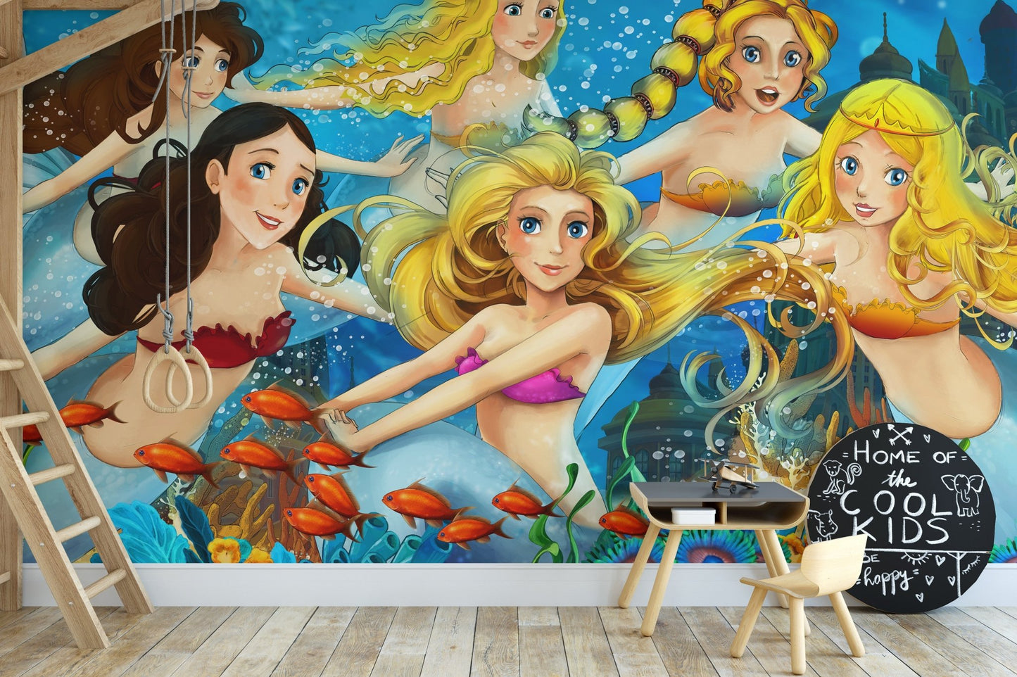 Colorful sea fairy tale wallpaper mural behind a child's study desk.